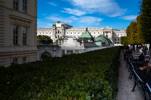 Detail of the towers of the Vienna City Hall and an ornate facade of a historical building, Austria