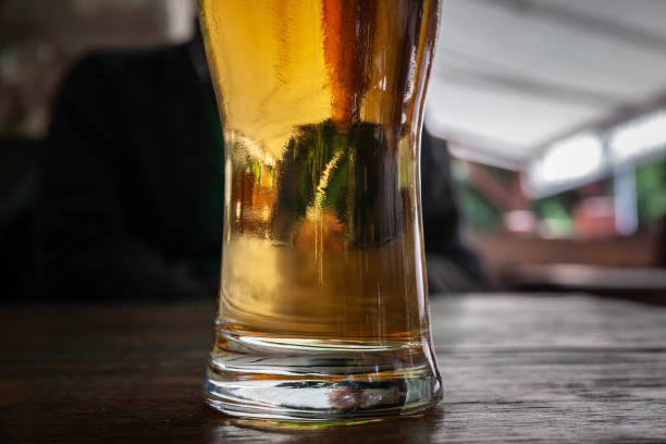 istock Selective blur on a Closeup on a beer mug containing a light beer, pilsner / lager style, served in a standard pint size glass. 1810278412