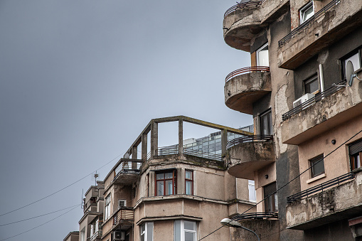 Picture of the panorama of a typical street of bucharest, Romania with decaying houses and flats.