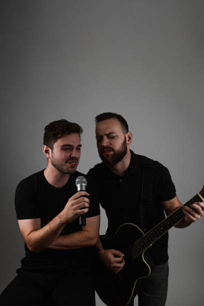istock Two Man Band Singing And Playing Songs Together 1810305337