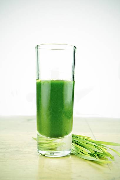 Wheatgrass in glass stock photo