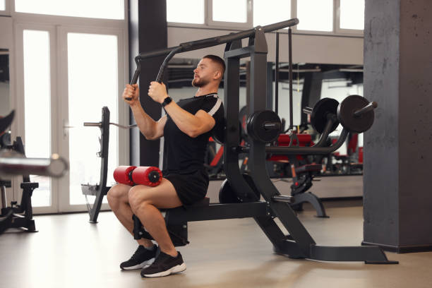 istock Man training with professional machine in gym 1810393134