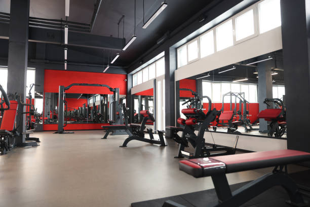 istock Spacious gym with professional equipment and mirrors 1810394177