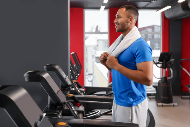 istock Happy trainer in modern gym, space for text 1810395766