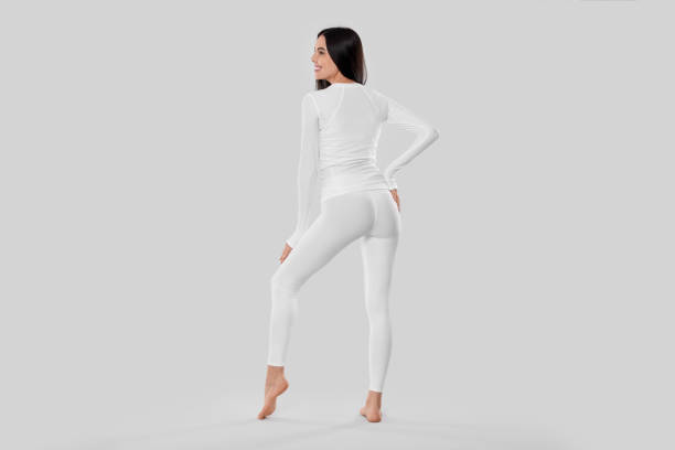 istock Woman in warm thermal underwear on white background, back view 1810420823