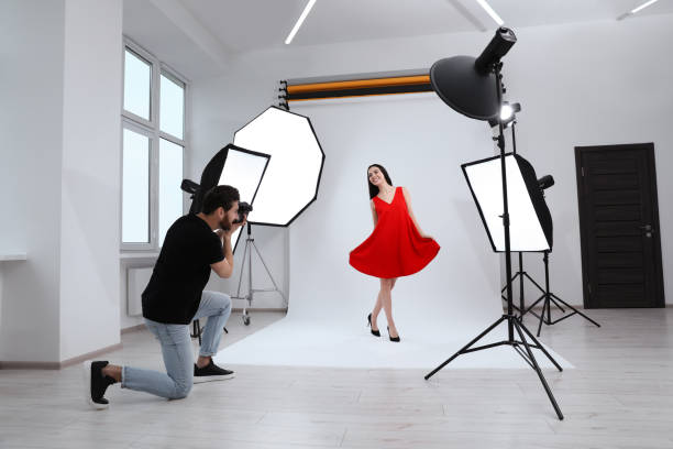 istock Beautiful young model posing for professional photographer in studio 1810422408