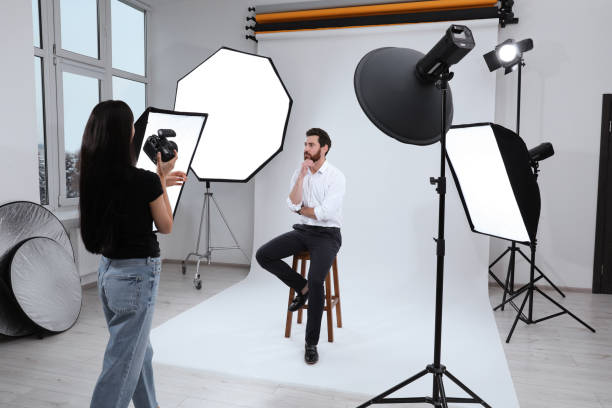 istock Handsome model posing for professional photographer in studio 1810422422