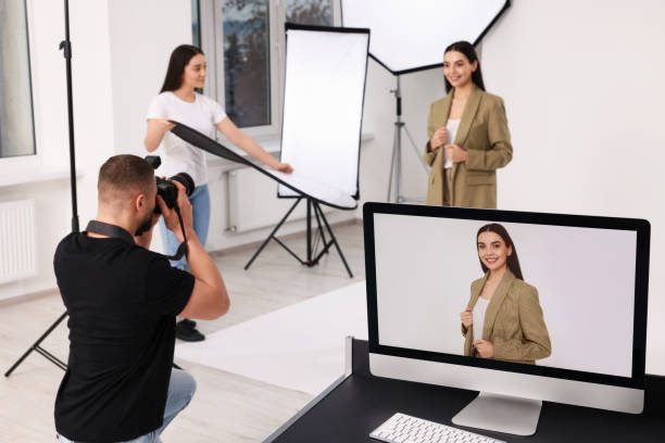 istock Professional photographer and assistant working with beautiful model in modern photo studio, selective focus 1810422943