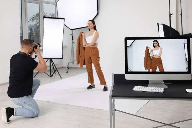 istock Professional photographer working with beautiful model in modern photo studio 1810423452
