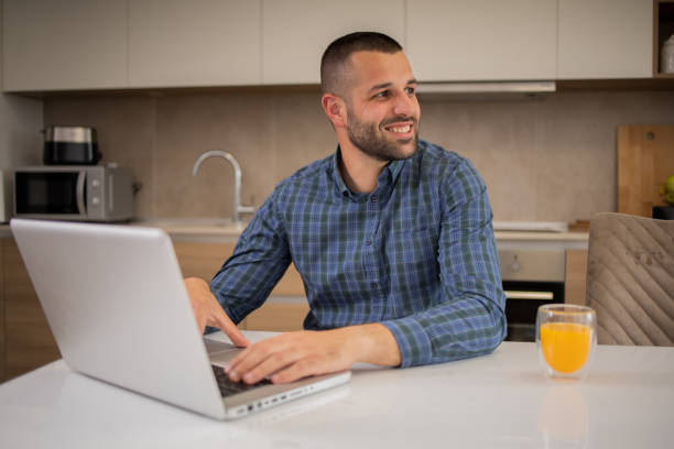 istock Young fashionable man working at home 1810429254