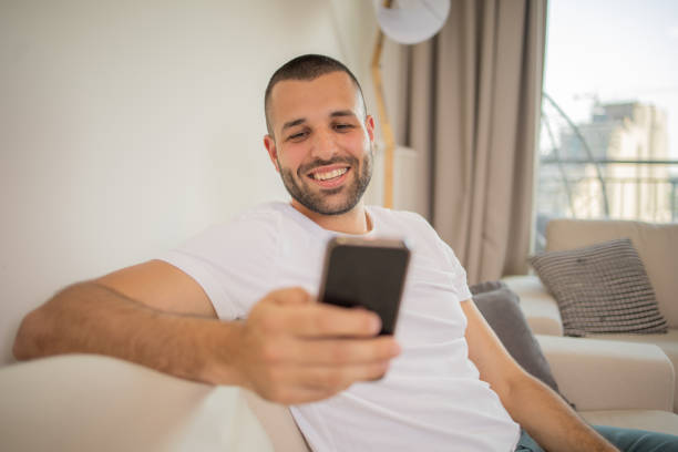 istock Portrait of a young man using smartphone 1810429796