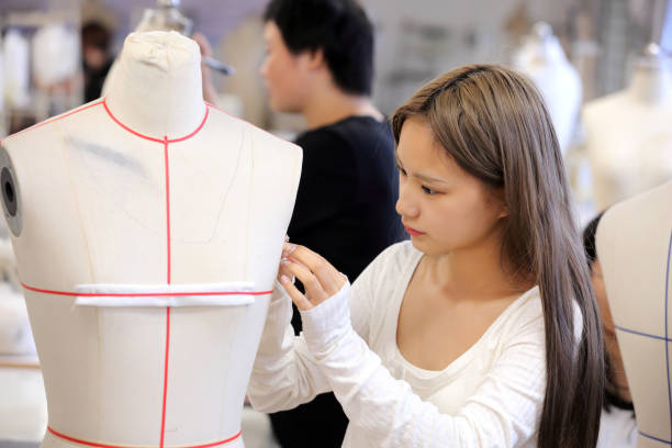 istock Young fashion designers are making patterns 1810438173