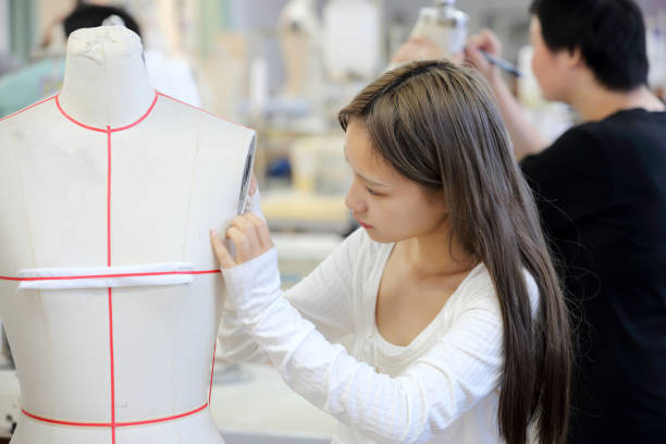 istock Young fashion designers are making patterns 1810438175