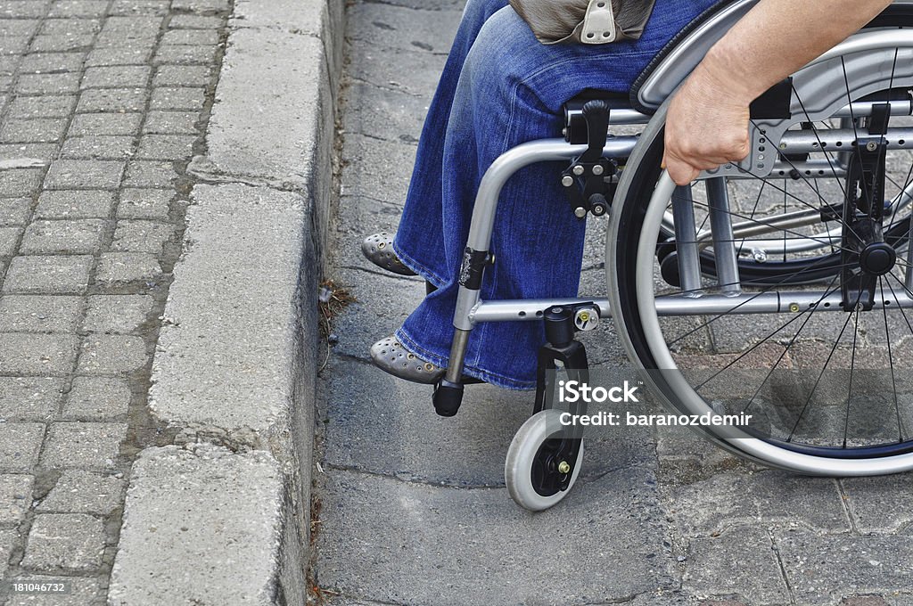 Problem Women in wheelchair needing assistance Wheelchair Stock Photo