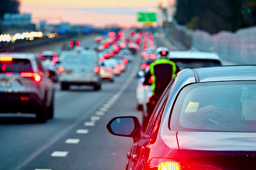 Vienna, Virginia, USA - November 20, 2023: Afternoon rush hour traffic clogs Interstate 66 heading westbound from Washington, D.C.