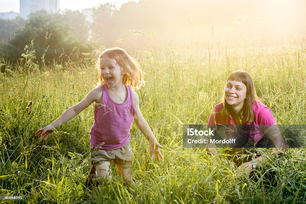 Mother and daughter outdoors Beautiful happy family spending time together in a summer park 2-3 Years Stock Photo