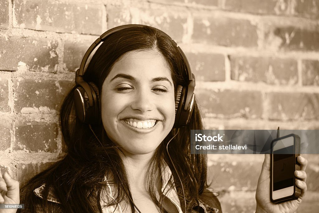 Listening to music Young woman listening to music. 20-29 Years Stock Photo
