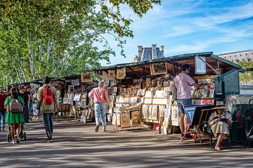 Booksellers of Paris are the famous outdoor bookshops that sell used books and some other vintage publications and souvenirs along the Seine river in Paris, France. October 1st, 2023