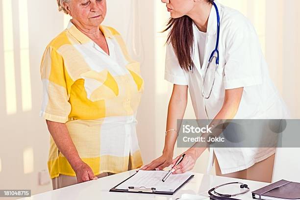 Young Doctor With Patient Stock Photo - Download Image Now - 60-69 Years, Adult, Adults Only