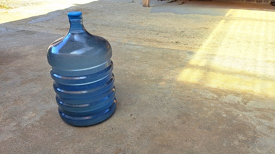 Gallons of drinking water lying on the floor are suitable for promotional media for household appliances and drinks