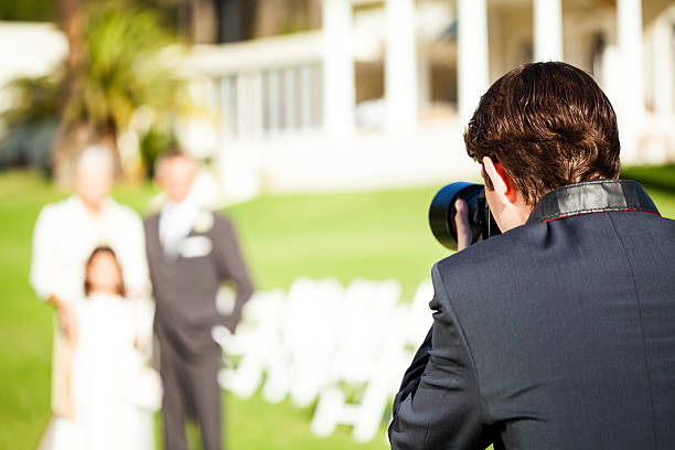 istock Man Photographing Family During Wedding 181049515