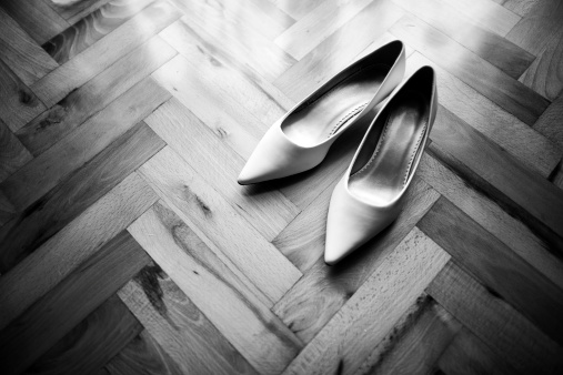 Bridesmaid's wedding shoes on a wodden floor. 