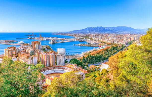 Malaga cityscape in Spain Malaga aerial cityscape, Costa del Sol, Andalusia, Spain - Sea cargo port in Mediterranean sea. málaga province stock pictures, royalty-free photos & images