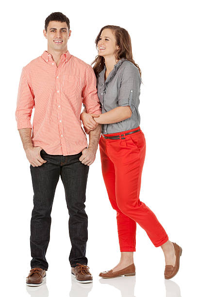 istock Happy young couple posing against white 181050931