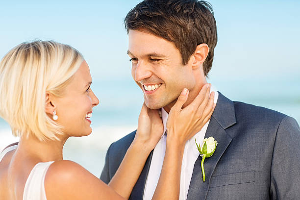 istock Loving Bride Looking At Groom On Beach 181051563