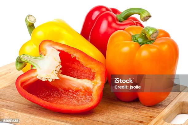 Bell Peppers On Cutting Board Stock Photo - Download Image Now - Bell Pepper, Color Image, Cross Section