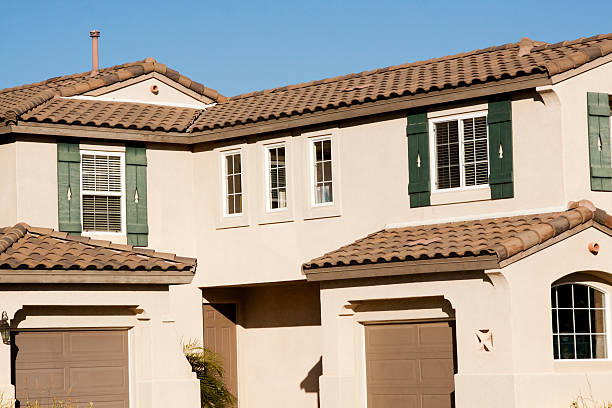 istock Stucco Home Exterior and Blue Sky 181051760