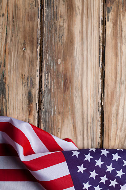istock American flag on wooden background 181051887