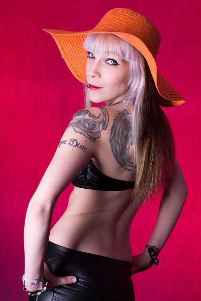 istock Woman in orange hat looking back over shoulder. 181052558