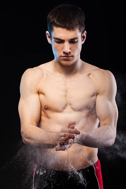 istock Young muscular male with powder 181052648