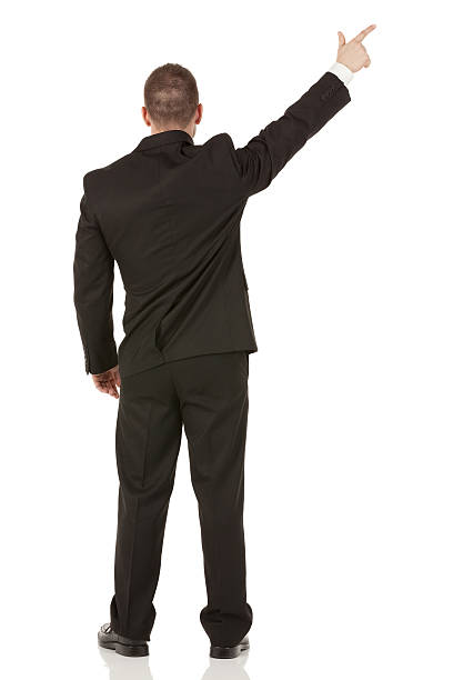 istock Rear view of a businessman pointing with finger 181053002
