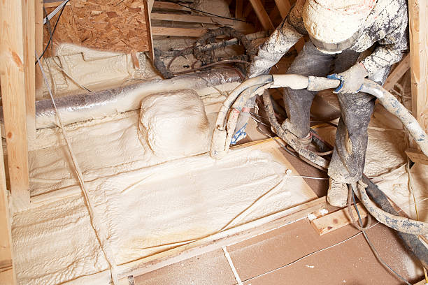 istock Worker Spraying Expandable Foam Insulation in House Attic 181053633