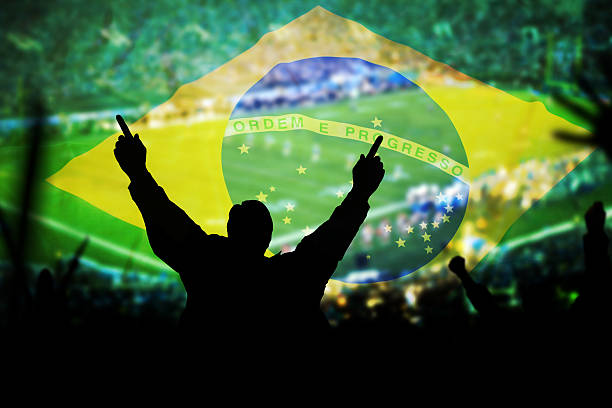 istock Man at footfall game and Brazilian flag background 181054478