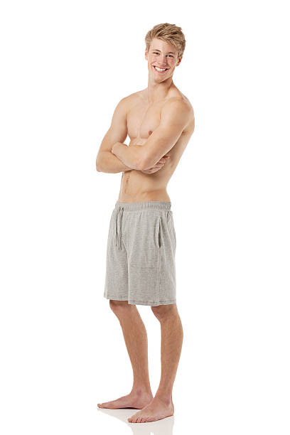 istock Smiling shirtless man posing with arms crossed 181054593