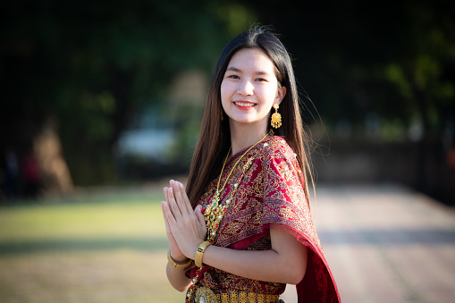 BeautifulAsian Woman in Thai traditional costume with ancient pagoda at temple at Wat Chai Watthanaram Ayutthaya