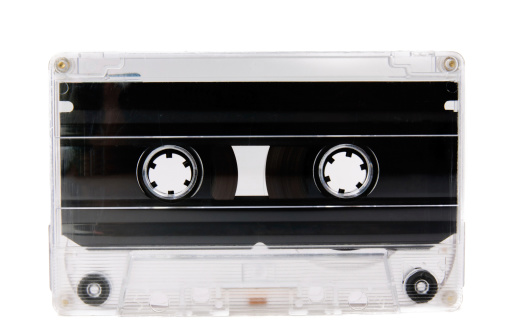 old and dirty audio cassette isolated on white.