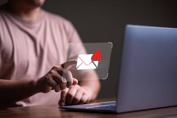istock Spam email and virus  concept, man using laptop with spam email icon,  scammer,  malware, virus. 1810551459
