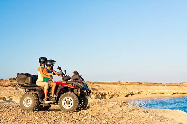 istock couple riding atv quad bike 181057108