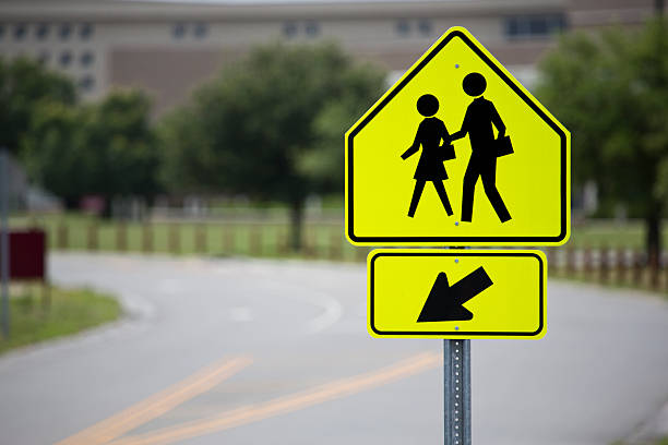 istock School Crossing Sign Education Facility and Road in Background Horizontal 181057611