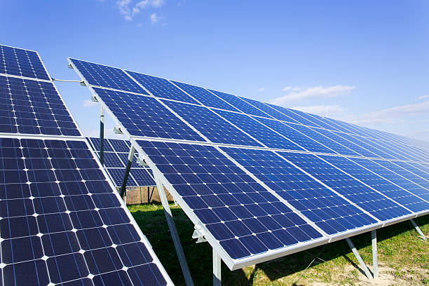 istock Solar panels on a sunny day against clear blue sky 181057732