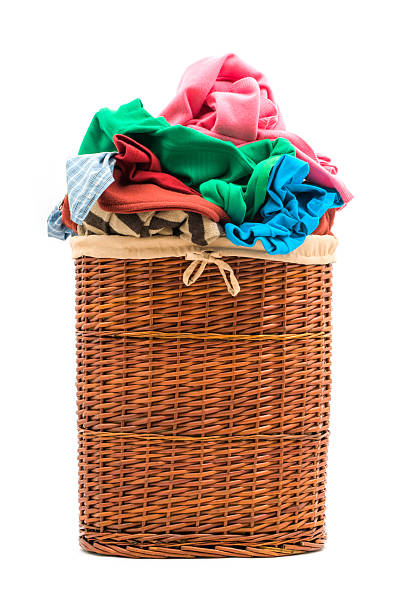 istock Laundry basket filled with clothes 181057881