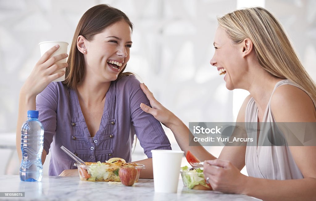 Catching up during lunch Two friends having lunch together Salad Stock Photo
