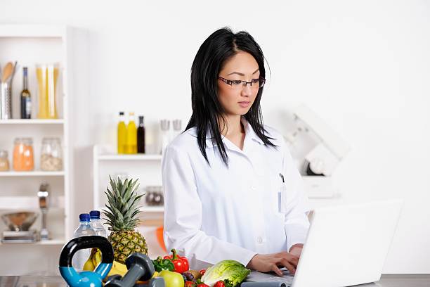 istock Oriental Healthcare Professional Using A Laptop 181058099