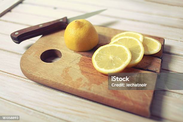 Slices Of Lemon On A Chopping Board Stock Photo - Download Image Now - Auto Post Production Filter, Backgrounds, Blade