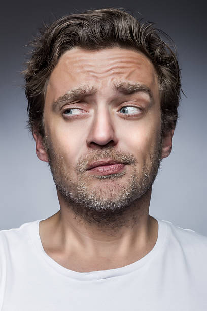 istock Close-up of a young man smirking 181058943
