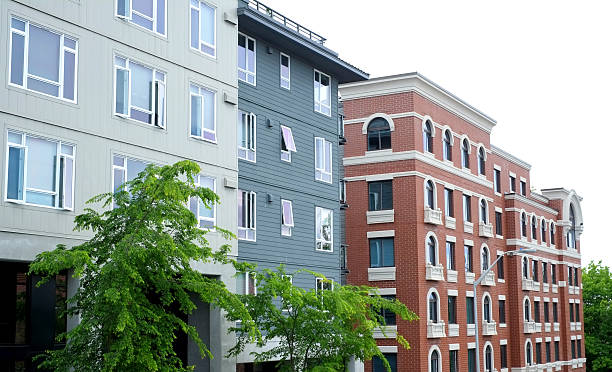istock Multi-colored apartment buildings street view 181059214